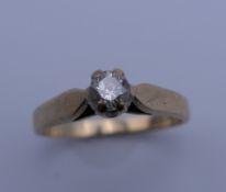 A 9 ct gold diamond solitaire ring. Ring size K/L. 2 grammes total weight.