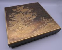 A Meiji Period Japanese lacquered artist's calligraphy box, the underside signed. 23.5 cm wide.