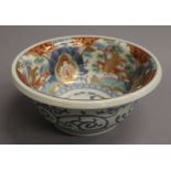 A Japanese Imari porcelain bowl of typical palette, square underglaze blue seal mark to base.