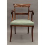 A 19th century mahogany open armchair. 52 cm wide.