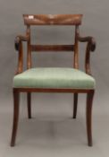 A 19th century mahogany open armchair. 52 cm wide.