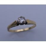An 18 ct gold diamond solitaire ring. Ring size N. 2.2 grammes total weight.