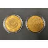 Two Chinese gilt coins, in cases. 4 cm diameter.