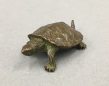 A small bronze model of a turtle. 5.5 cm long.