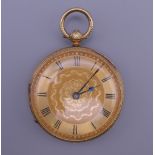 An 18 ct gold cased pocket watch. 4 cm diameter. 62.4 grammes total weight.