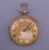 An 18 ct gold cased pocket watch. 4 cm diameter. 62.4 grammes total weight.