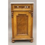 A Victorian marble topped walnut pot cupboard. 83 cm high x 46 cm wide.