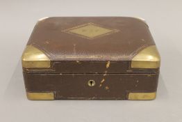 A 19th century French brass bound leather box. 28 cm wide.