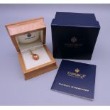 A boxed 18 ct gold Victor Mayer Faberge egg form pendant, with registration book, 2009. 3 cm high.