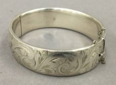 A silver bangle form bracelet. 7 cm wide. 48.5 grammes.