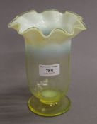 An uranium and vaseline glass vase. 18 cm high.