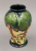 A small modern Moorcroft vase. 15.5 cm high.