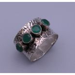 A silver green stone set ring. Ring size O/P/Q.