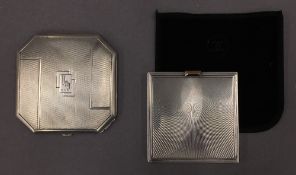 An Art Deco silver compact and another silver compact. The former 6.5 cm wide.