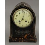 An Edwardian silver mounted tortoiseshell mantel clock. 24 cm high.