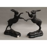 A pair of model boxing hares. 29 cm high.