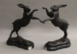 A pair of model boxing hares. 29 cm high.