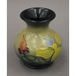 A small modern Moorcroft Hypericum pattern vase. 9 cm high.