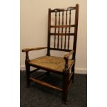 A rush seated ash stick back armchair. 51 cm wide.