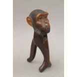 A carved treen nutcracker formed as a monkey. 20.5 cm high.