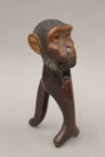 A carved treen nutcracker formed as a monkey. 20.5 cm high.