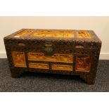 A carved Chinese camphor wood chest. 69 cm wide.