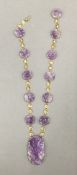 A 14 ct gold mounted amethyst pendant necklace. 38 cm long.