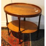 An early 20th century walnut oval tea table. 64.5 cm long.