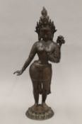 An antique patinated bronze model of Buddha. 42 cm high.