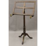 An adjustable music stand. 55 cm wide.