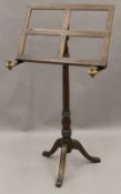 An adjustable music stand. 55 cm wide.