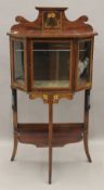 An Edwardian mahogany display cabinet. 111 cm high x 56 cm wide.