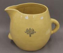A large Victorian Armorial pottery jug. 35 cm high.