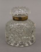 A Victorian cut glass inkwell. 9 cm high.