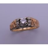 A 14 ct gold diamond ring. Ring size L/M. 4.2 grammes total weight.