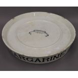 A Victorian white pottery margarine slab. 42 cm diameter.