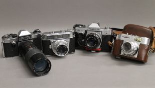 A collection of vintage cameras, including Voigtlander, etc.