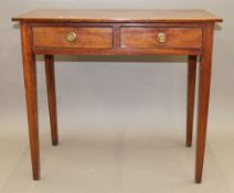 A 19th century mahogany bow front two drawer side table. 83.5 cm wide.
