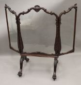 A 19th century mahogany framed and glazed country house fire screen. 111 cm high.