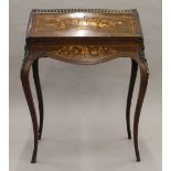 A 19th century inlaid rosewood bonheur du jour. 70.5 cm wide.