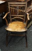 A 19th century elm seated Windsor chair. 52 cm wide.