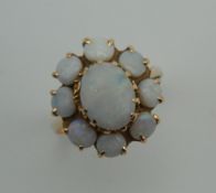 A 14 K gold and opal ring. Ring size N. 4.2 grammes total weight.