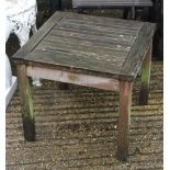Two wooden folding garden chairs and a table
