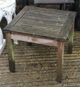 Two wooden folding garden chairs and a table