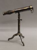 A small telescope and stand. 23 cm long.