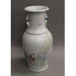 A Chinese porcelain vase decorated with figures. 44 cm high.