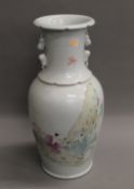 A Chinese porcelain vase decorated with figures. 44 cm high.