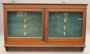 A Victorian glazed mahogany gun cabinet. 134 cm wide x 79 x 14 cm.