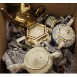 A large collection of porcelain teapots