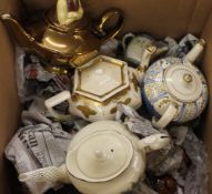 A large collection of porcelain teapots